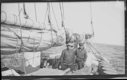 Image of Two men aboard, aft